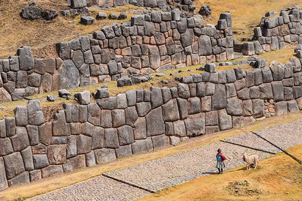 Local woman with her llama on the way to town in Cusco