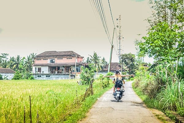 Scooter hire is a cheap and readily available way to get around Ubud