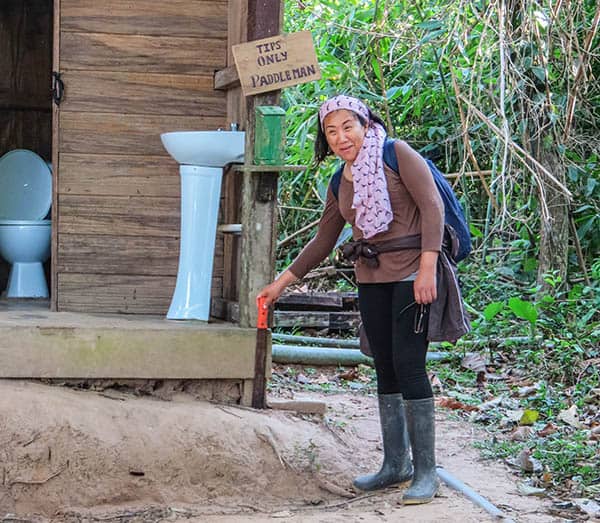 The "just in case" machete is kept near the door of this jungle toilet