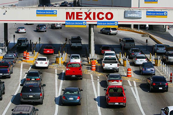Rent a car in Mexico and not try to cross the border with one from USA
