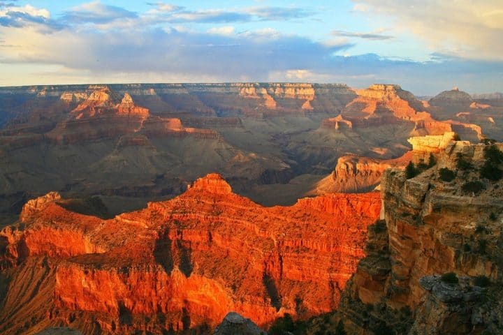 The best time to experience the Grand Canyon is at sunrise or sunset when the shadows add depth to this vast scene.