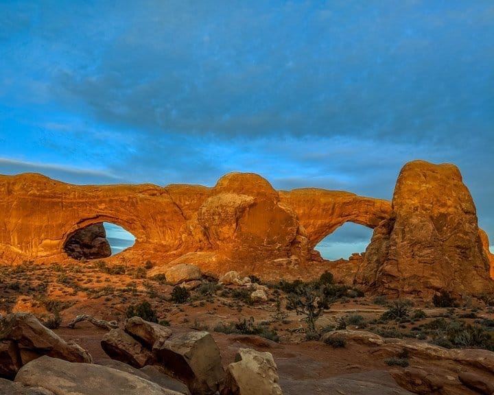 The rocks appear to turn to gold as the last rays of sun strike them at Arches National Park