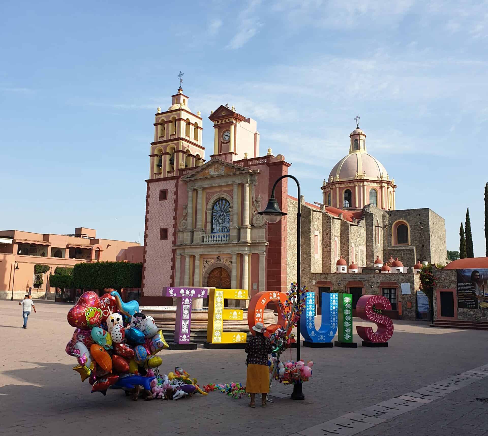 A vendor selling colourful balloons in the Zocalo of Tequisquiapan Mexico