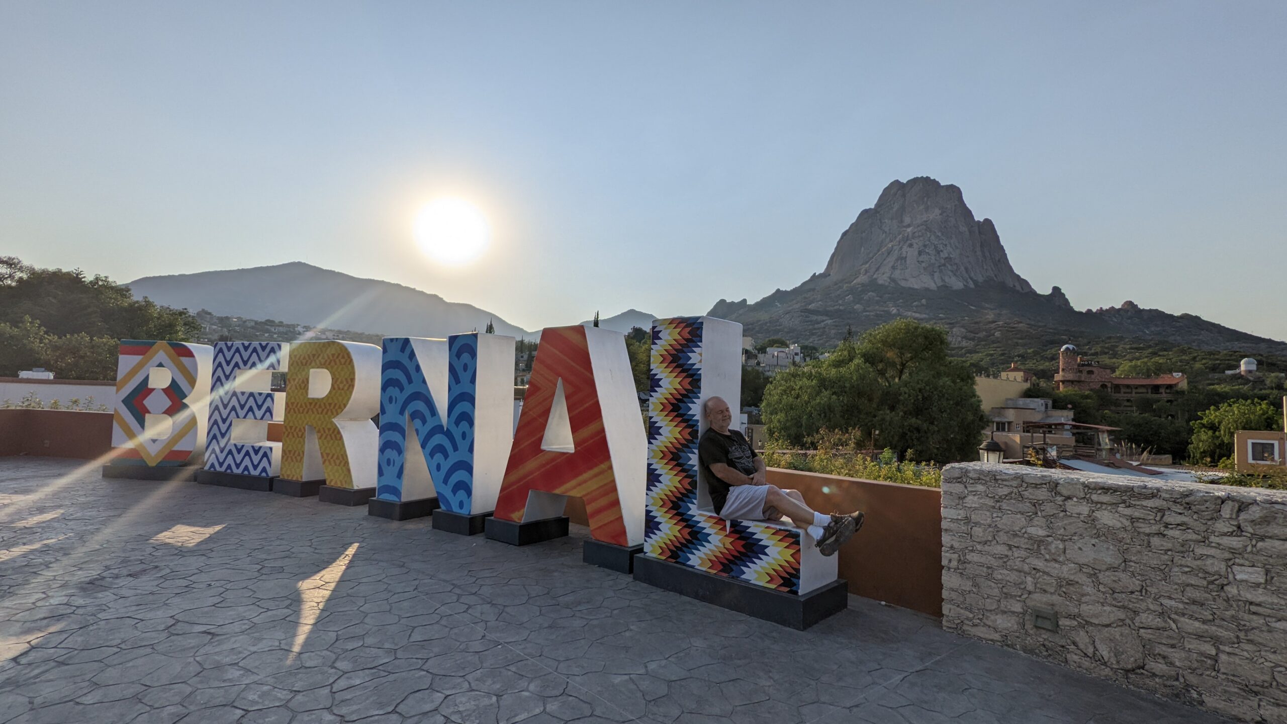 the city letters with the famous pena de Bernal in the background