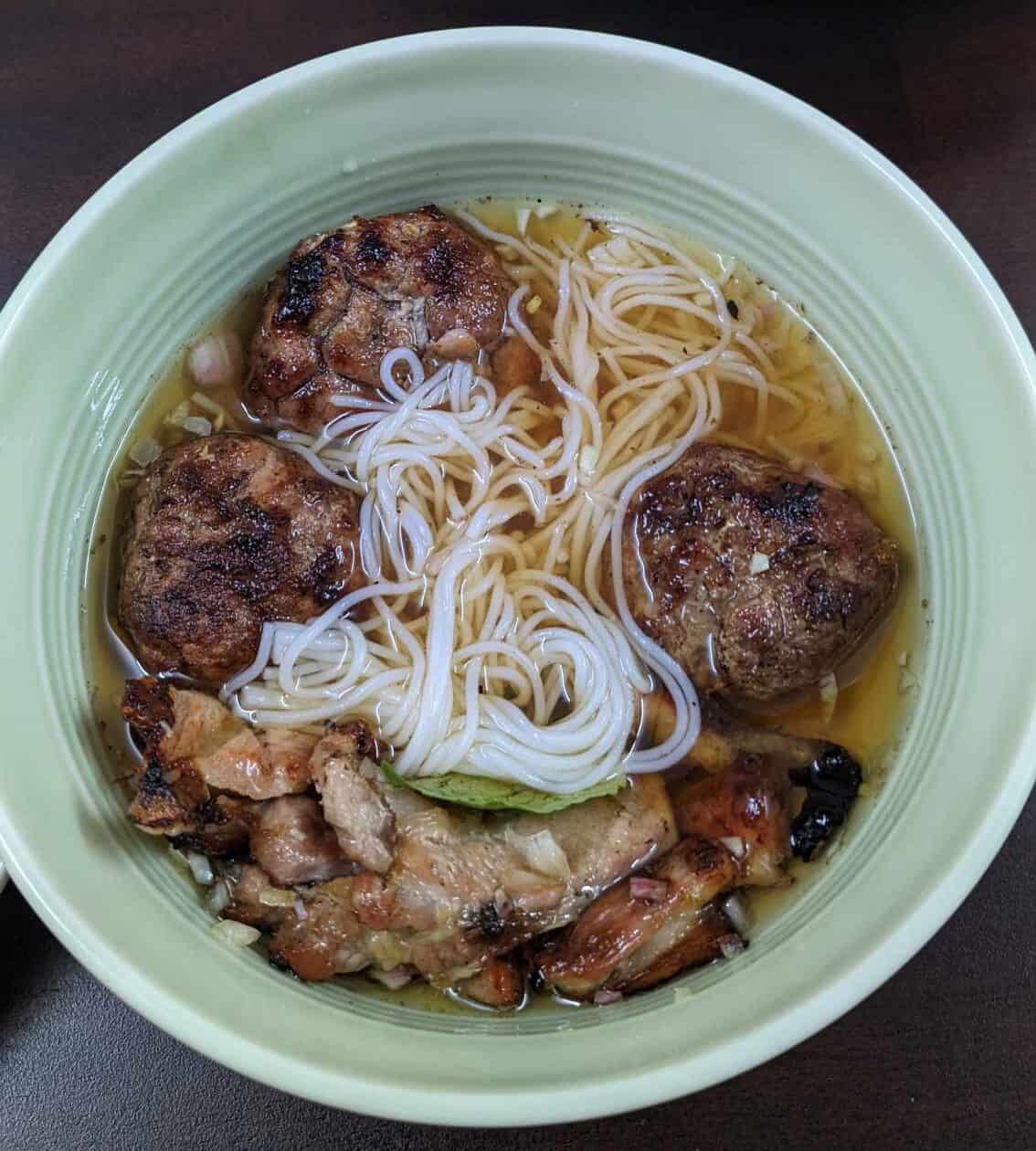 a bowl of frshly made bun cha, a vietnamese pork meatball dish