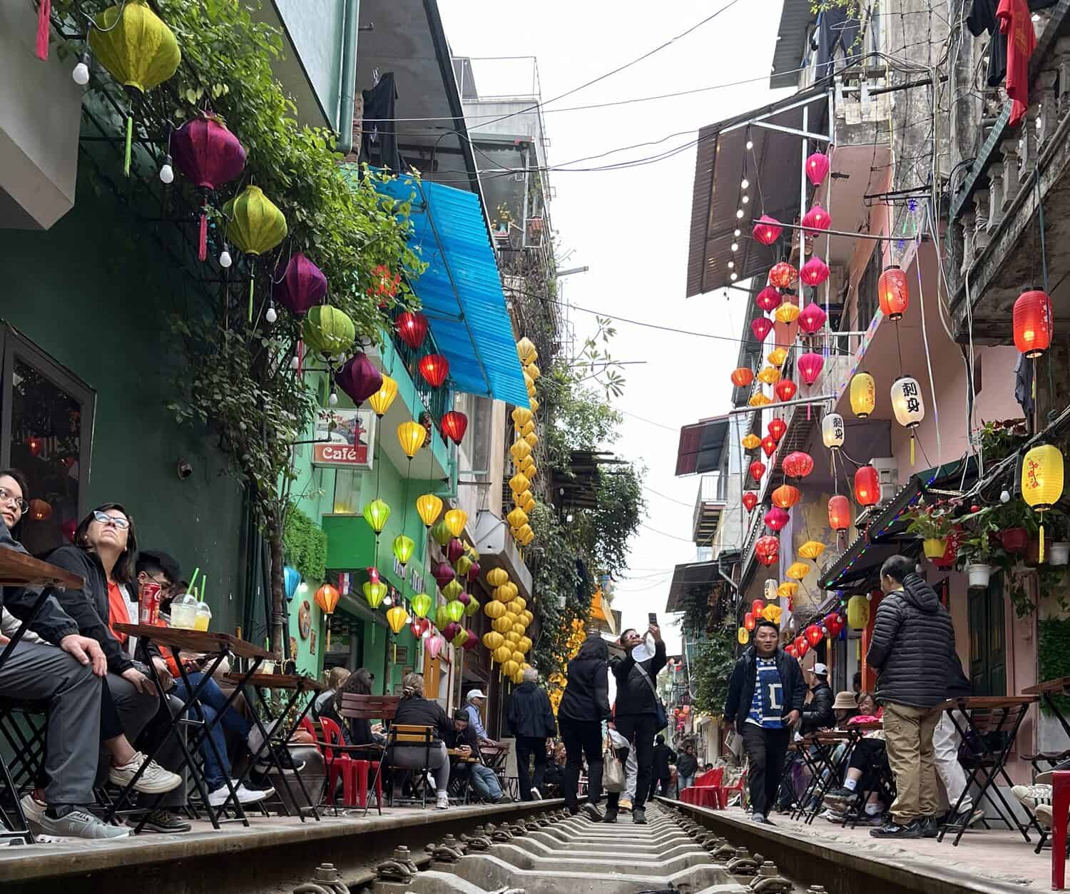 crowds starting to gather waiting for the show on Train Street in Hanoi