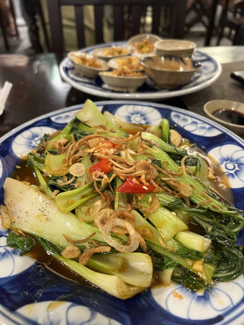 A simple plate of bok choi elevated to create a flavour bomb in Hue