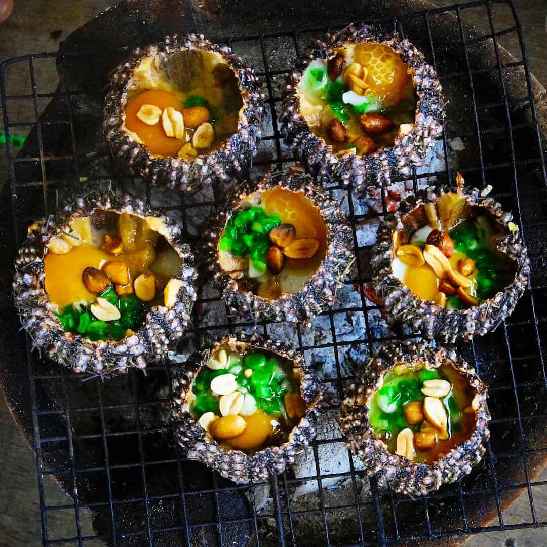 Grilling sea urchin at the night market in phu quoc